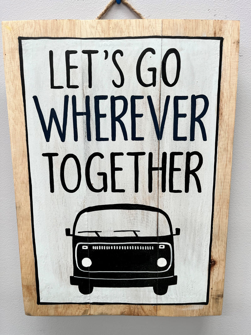 Painted "Lets go wherever together" Sign