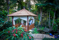 Shingle roof bali hut with light shades provide a serene feel